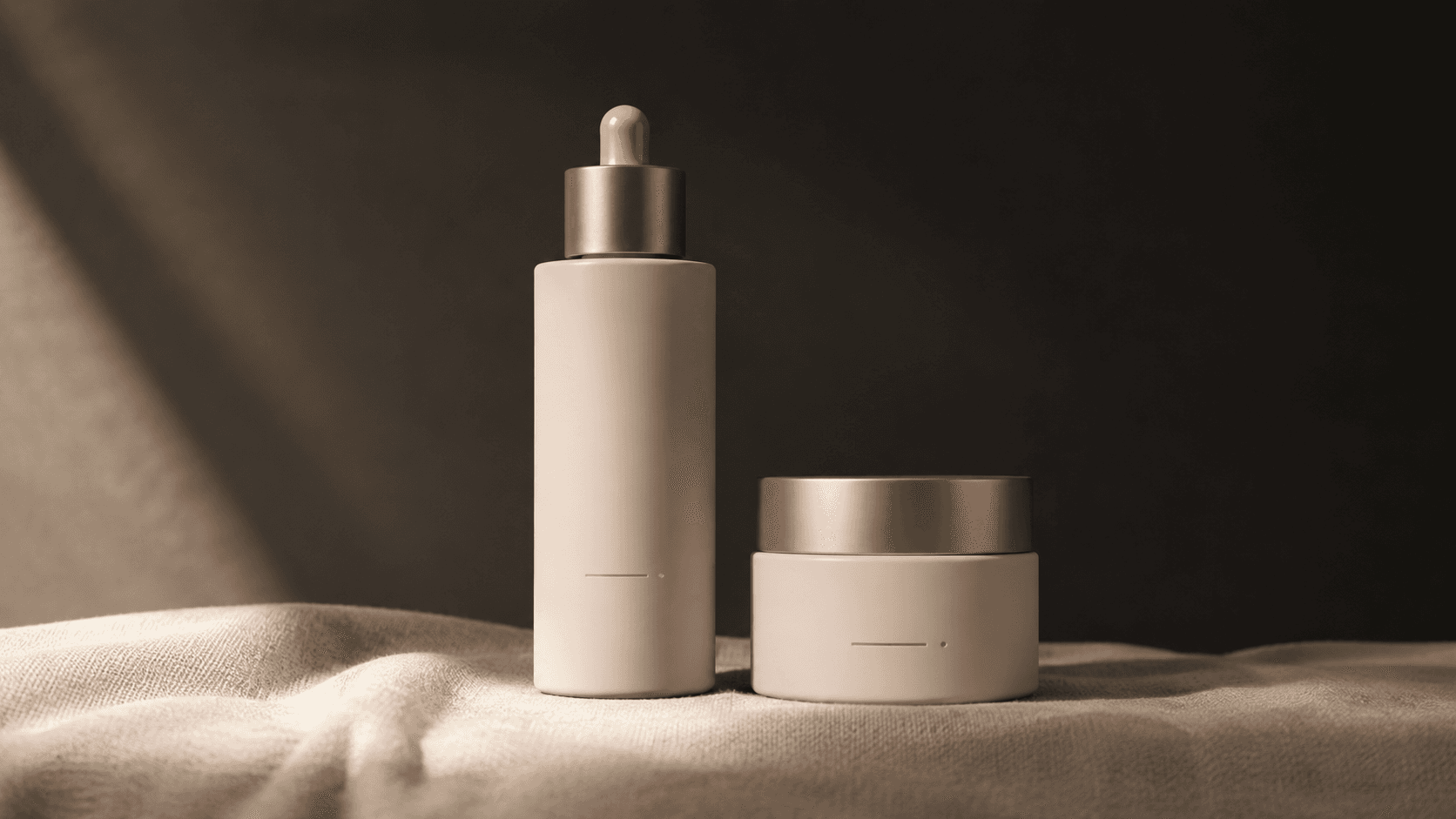 Hero dropper + cream jar — porcelain blush + champagne gold.