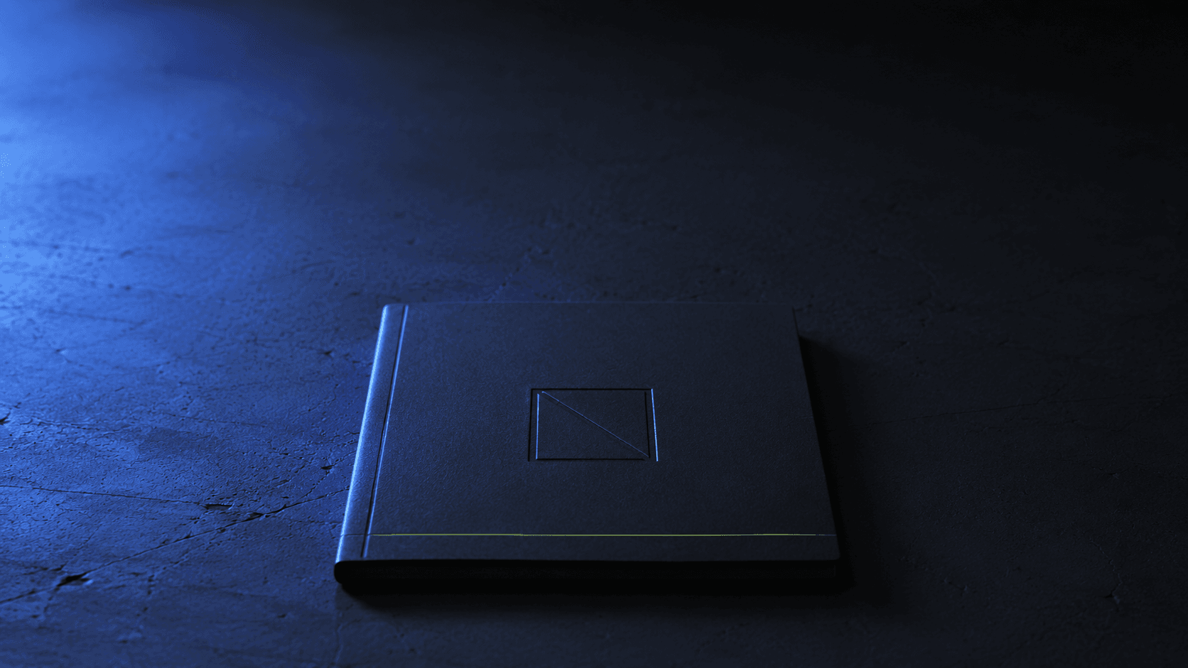 The Northform N — debossed into matte black, lit by electric-blue ambient.